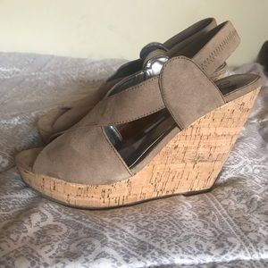 Beige suede platform shoes.
